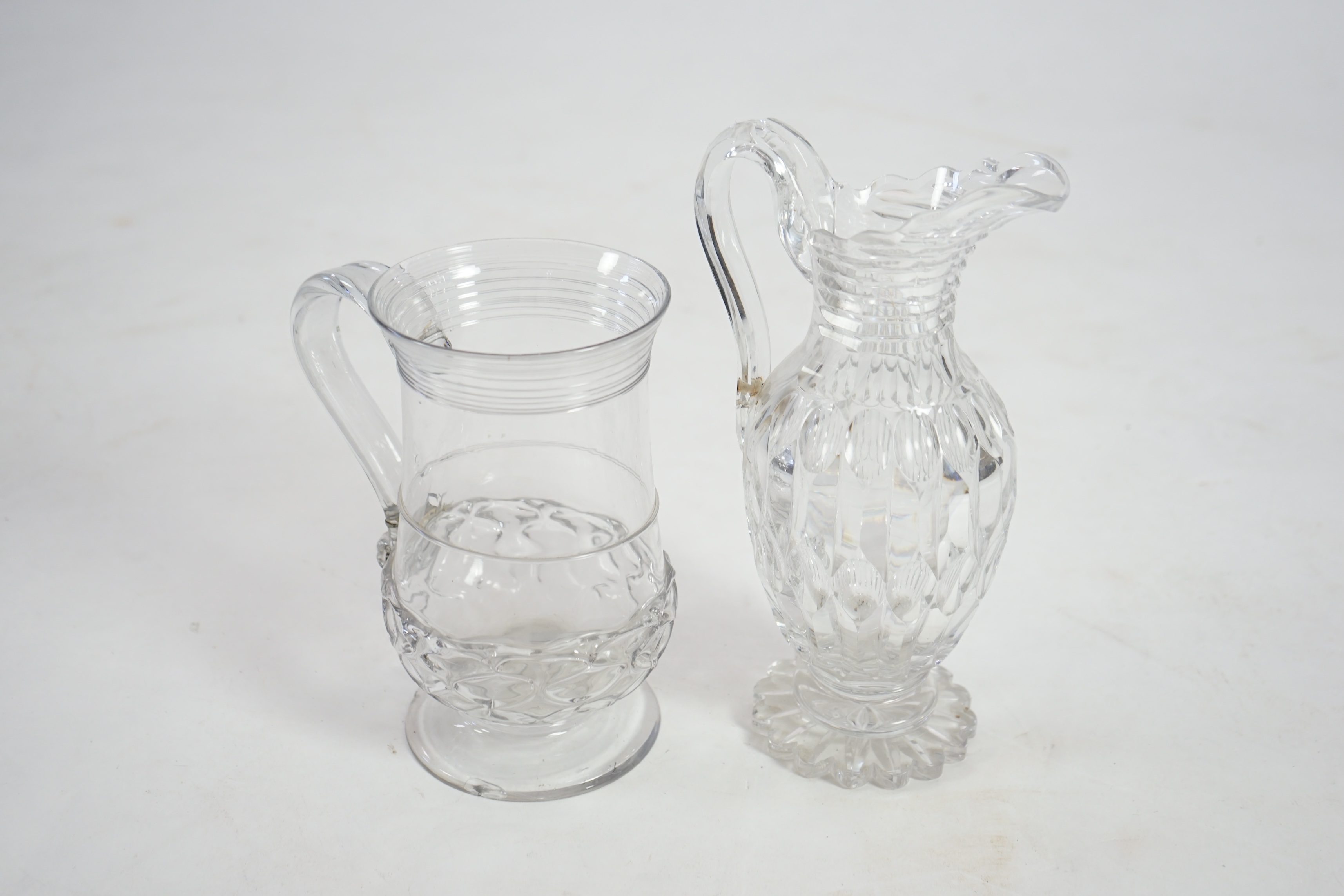 An 18th century wrythen moulded glass ale jug